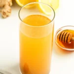 secret detox drink made with apple cider vinegar, lemon, ginger, and cayenne